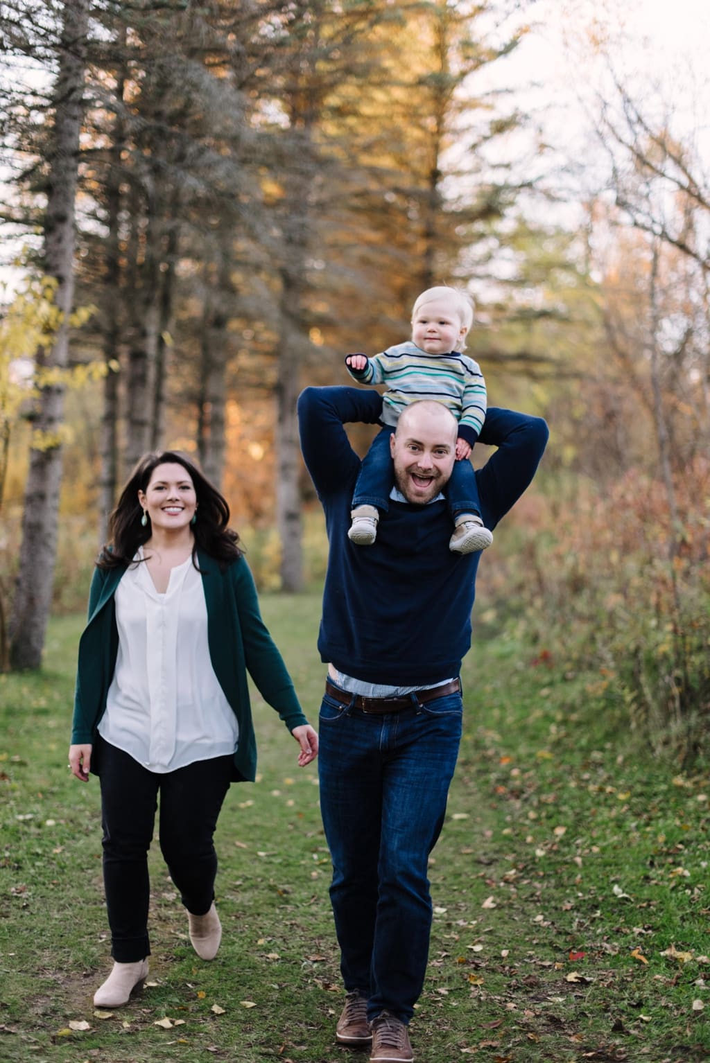 dad giving toddler a ride on shoulders