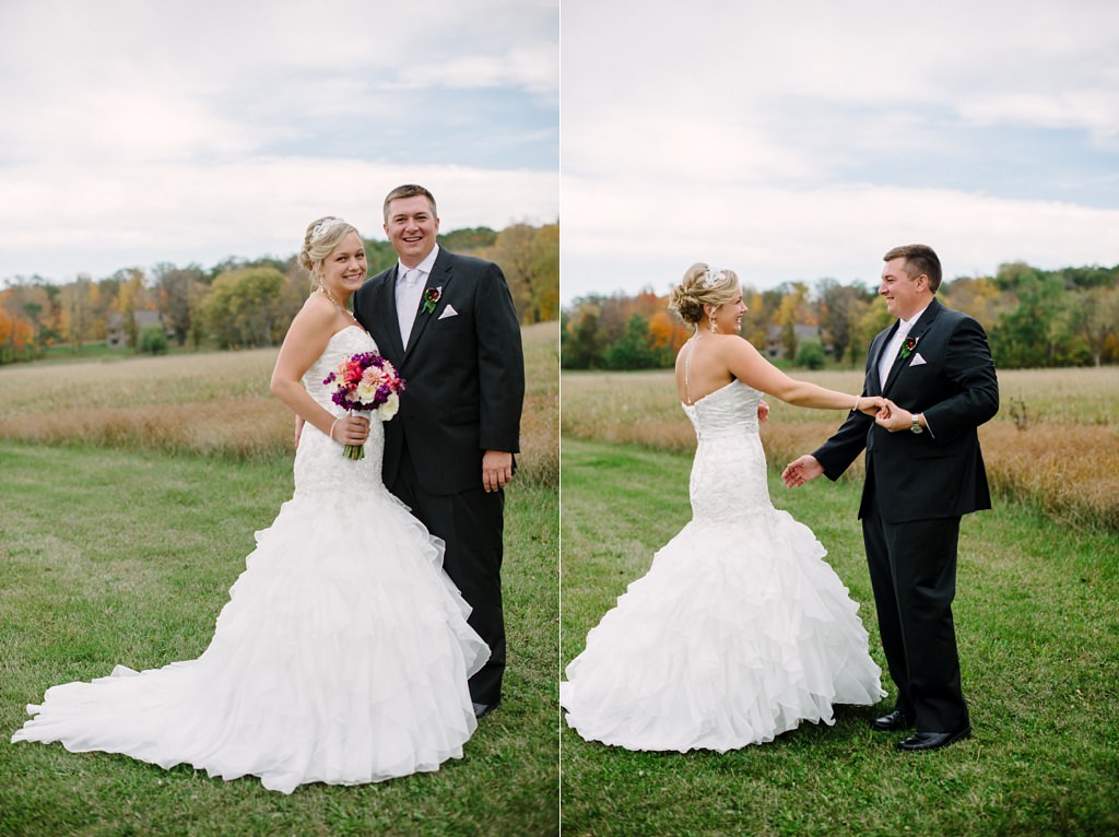 bride and groom dance in field at wisconsin winery