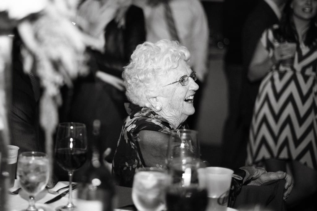 guest laughs at wedding reception