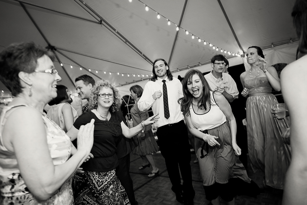 guests dance and enjoy backyard wedding reception