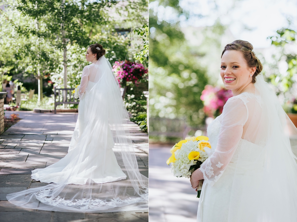 bride in wedding dress at minnesota arboretum looking over shoulder