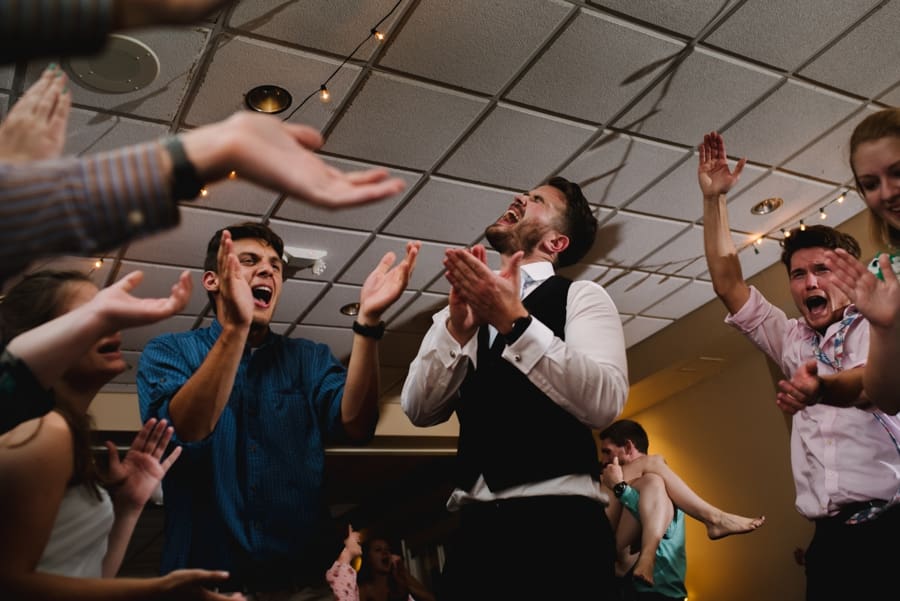 reception guests dancing and clapping 