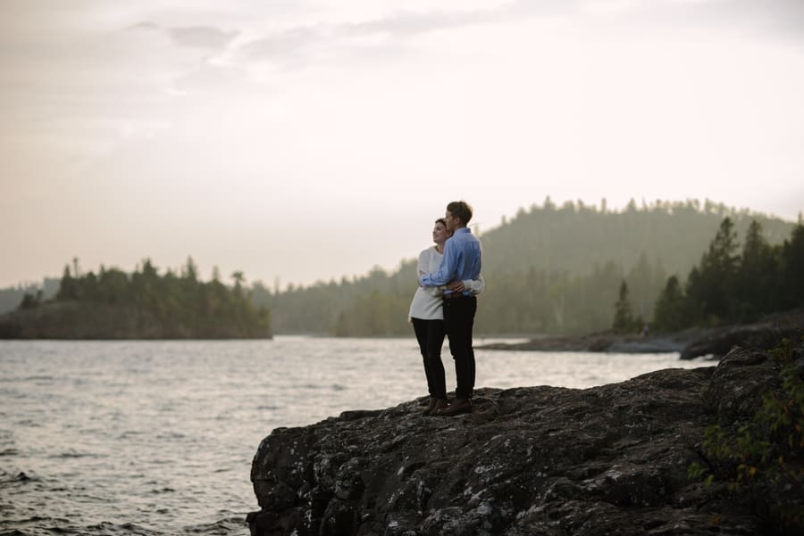 romantic sunset couple beside lake