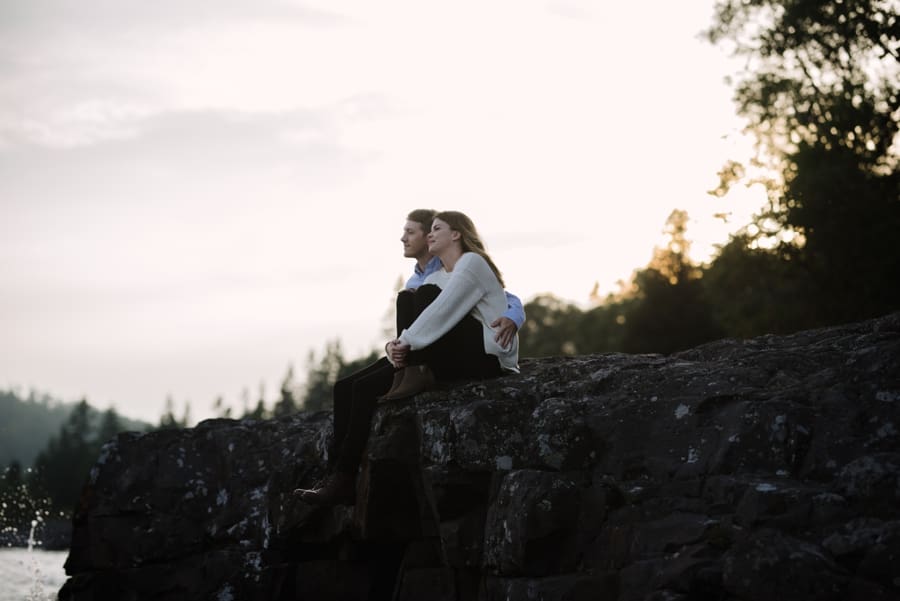couple enjoying sunset at lake superior