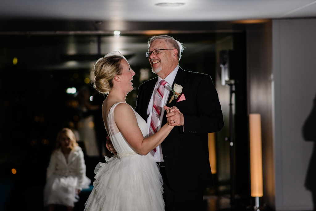 father daughter smiling at their wedding dance 