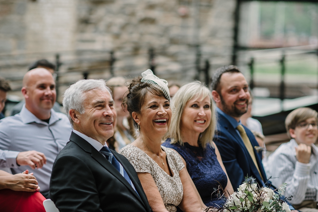 wedding guests smile at mill city museum ceremony
