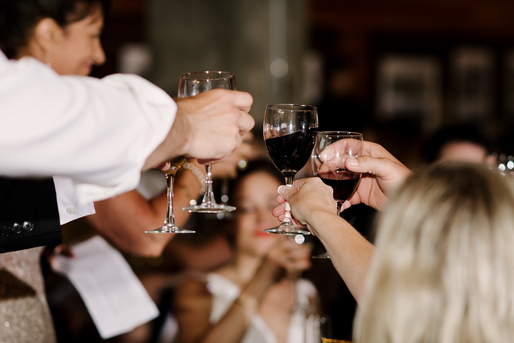 wedding party toasting at reception