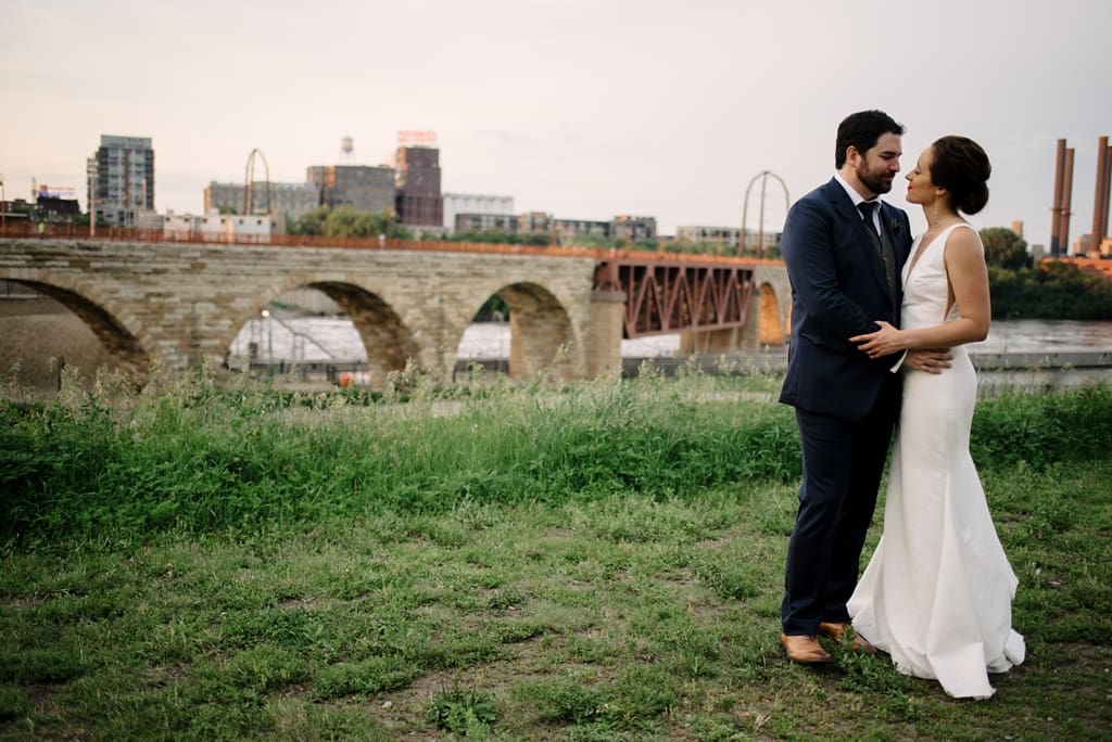 wedding portraits by stone arch bridge minnesota
