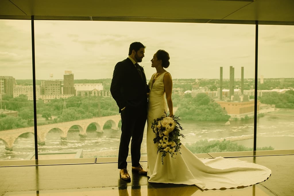 yellow cast wedding portrait in mill city museum minneapolis