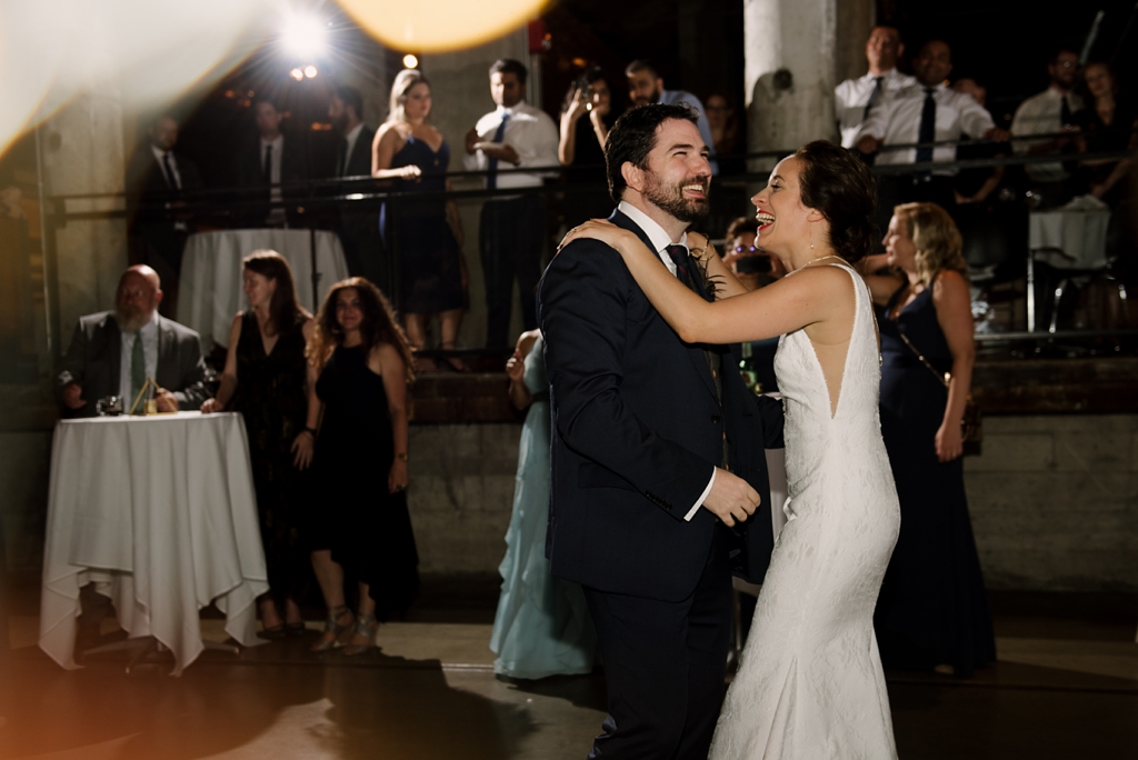 bride and groom dancing together at wedding reception