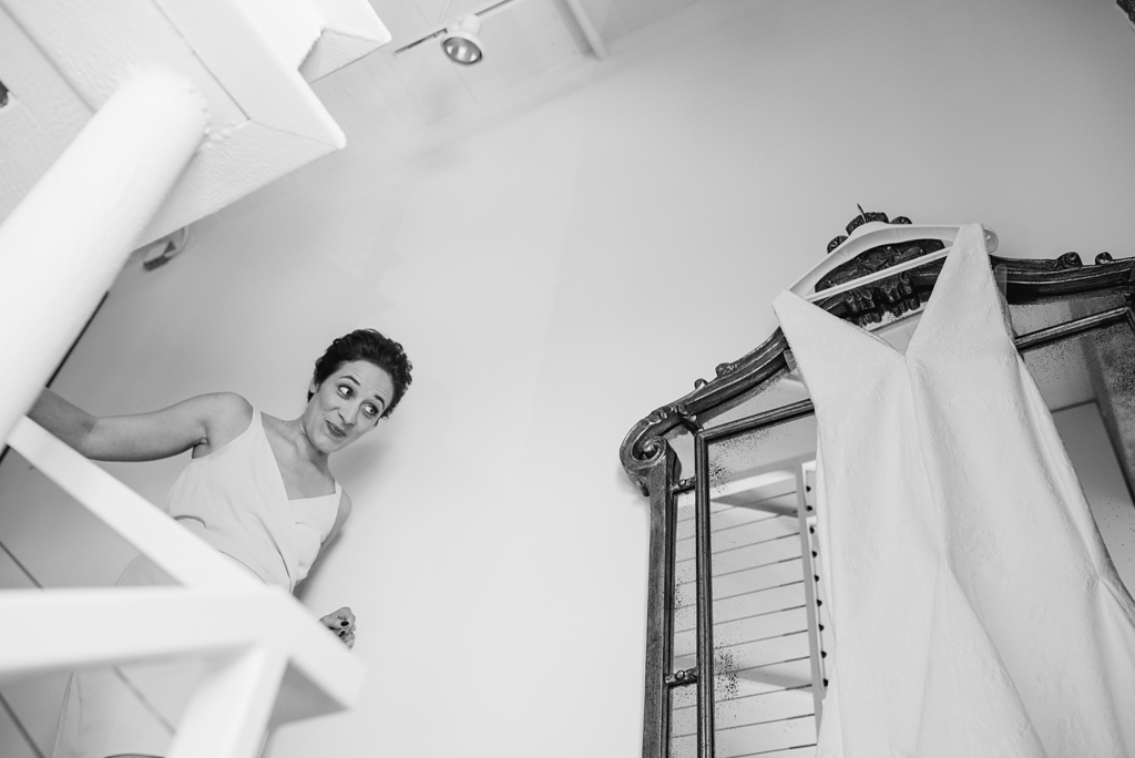 Bride admiring her dress before Minneapolis wedding