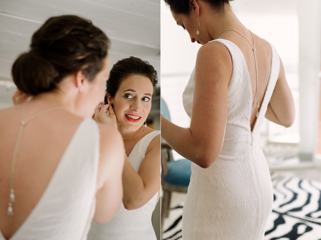 bride putting on jewelry before Minneapolis wedding