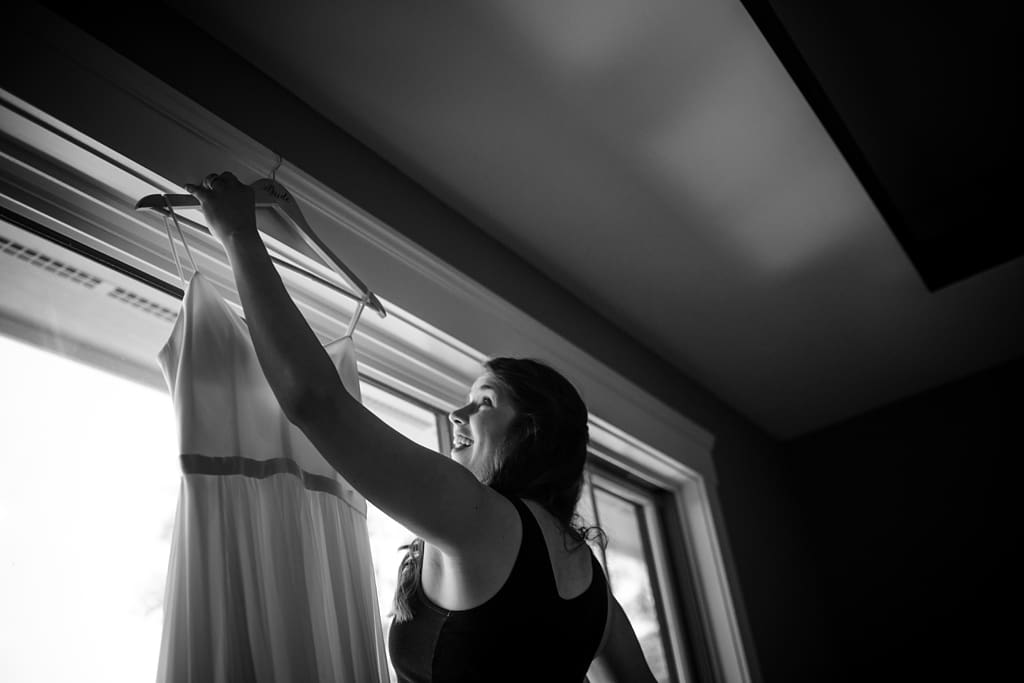 bride getting her dress in Wisconsin Camp Wedding