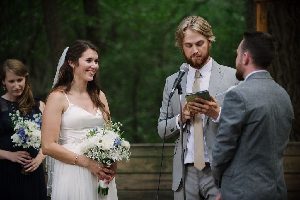 bride smiling at groom during ceremony