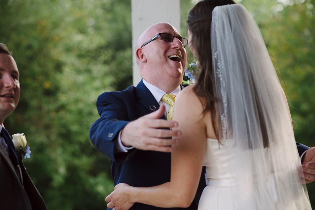 bride hugging wedding guest