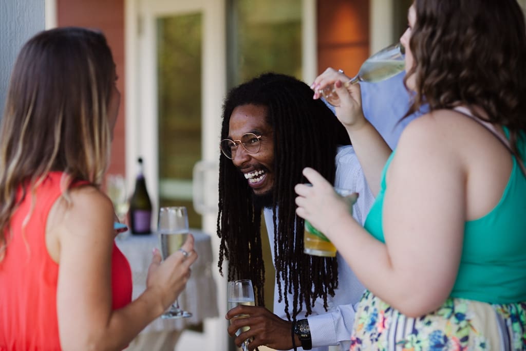 wedding guests laughing at reception