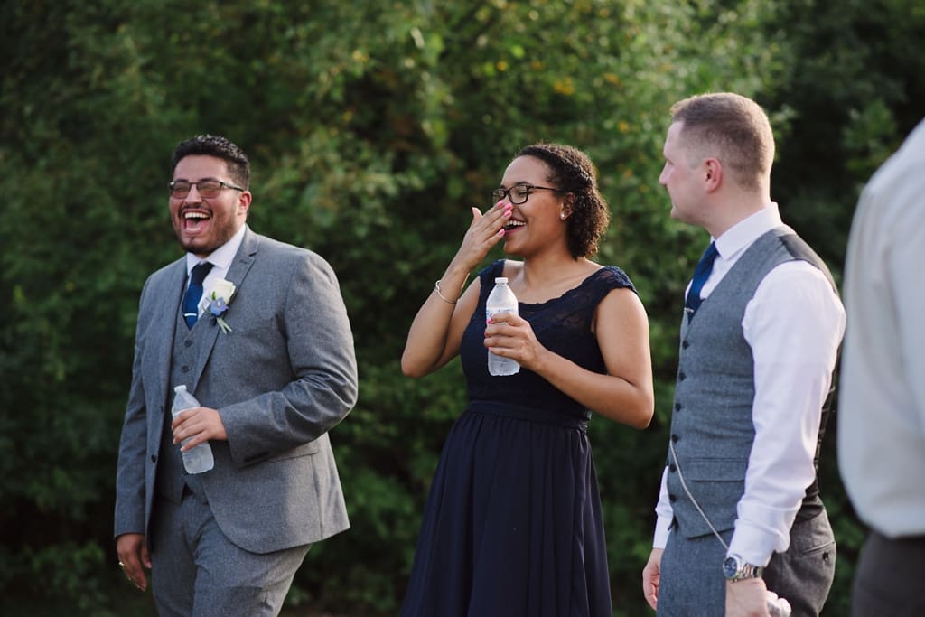 wedding guests laughing