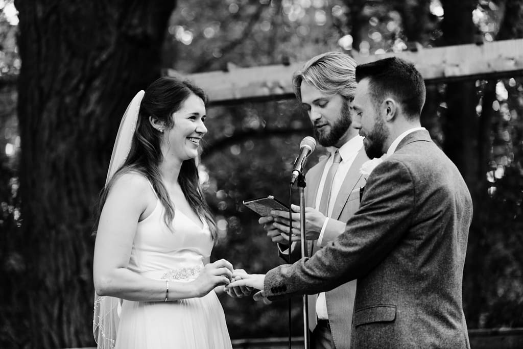 bride and groom exchanging rings