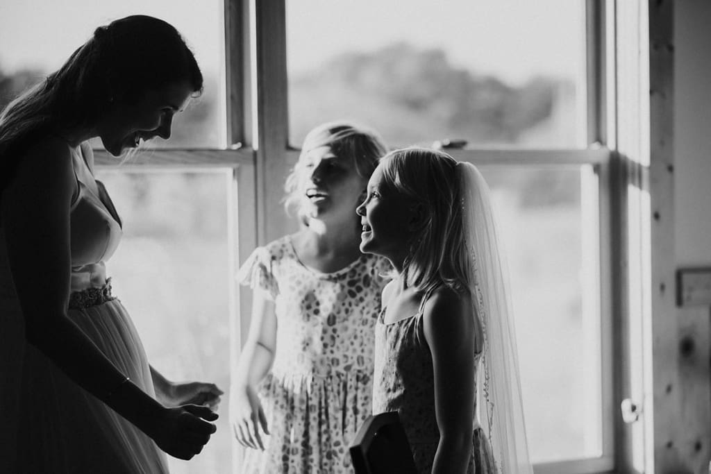girl trying on bride's veil