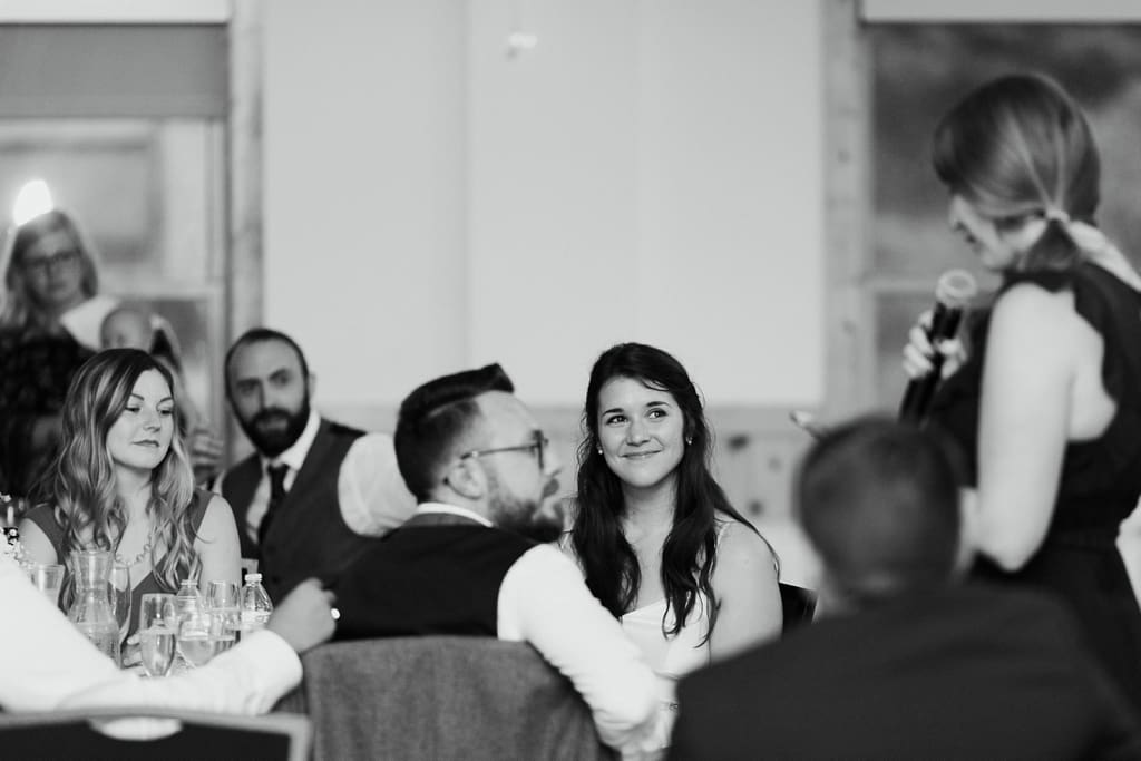 bridesmaid toasting bride and groom