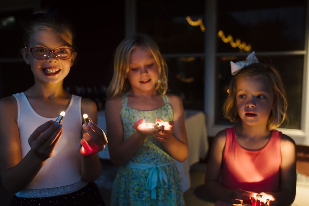 wedding guests holding LED lights