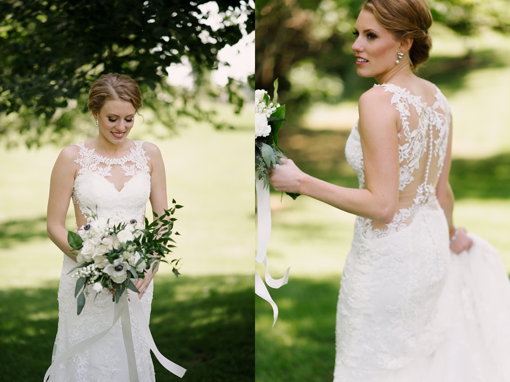 bride wearing lace wedding dress with cutout back