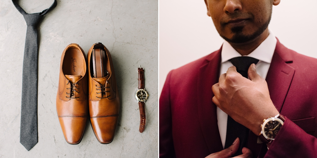 groom accessories, groom straightening tie in burgundy jacket
