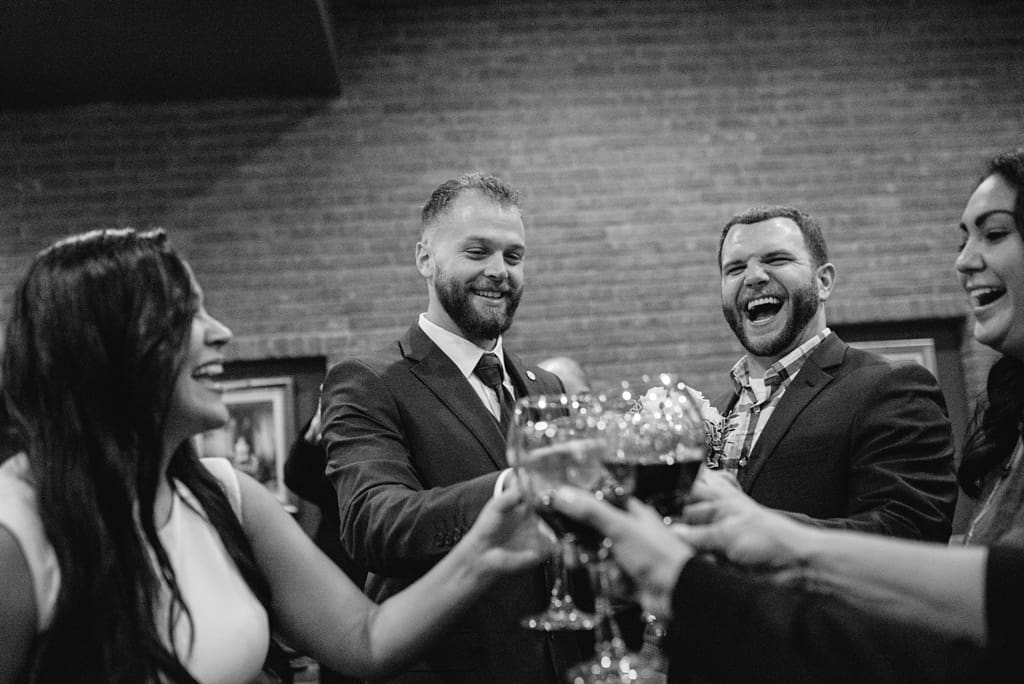 elopement reception toasting with wine