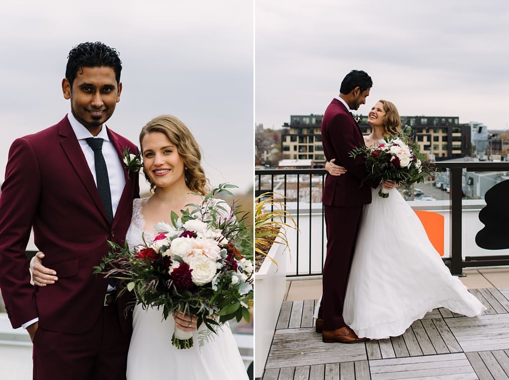 newlyweds embracing on rooftop in minneapolis