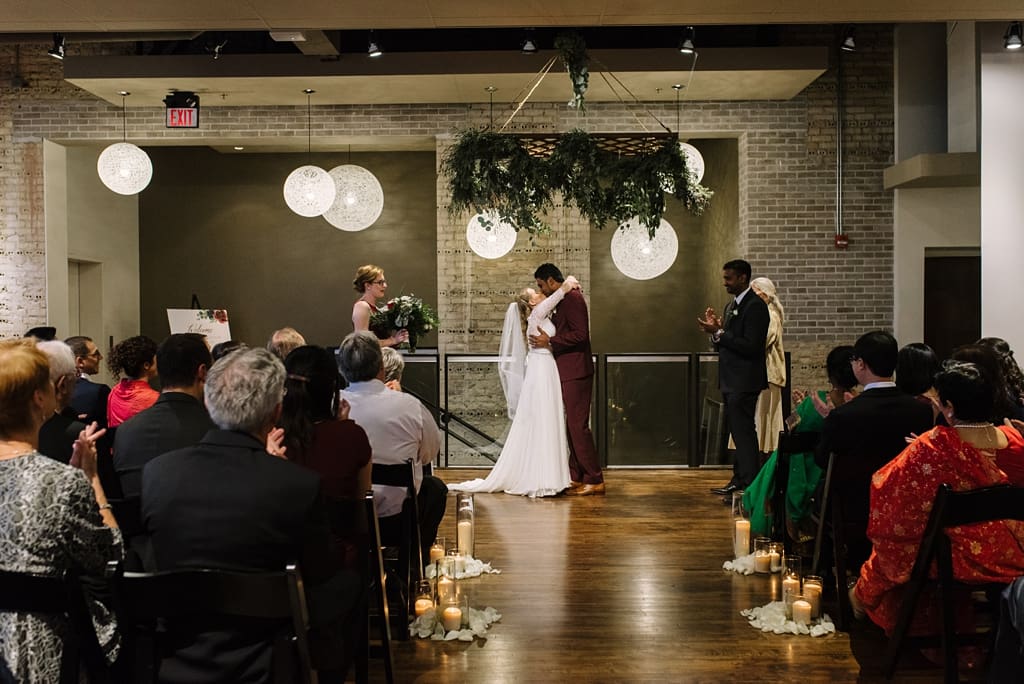 bride and groom kiss at minneapolis wedding