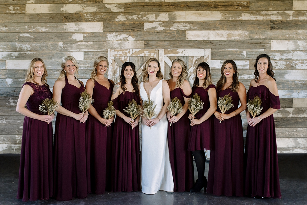 bridal party smiles with rustic bouquets before serenity hills wedding