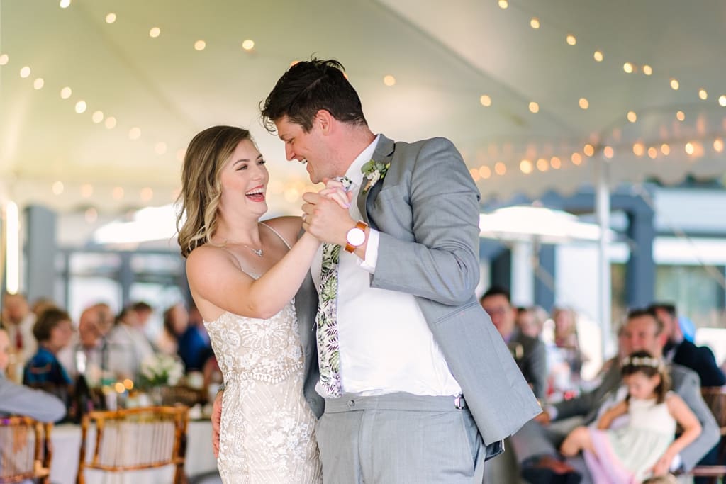 bride and groom laugh during first dance