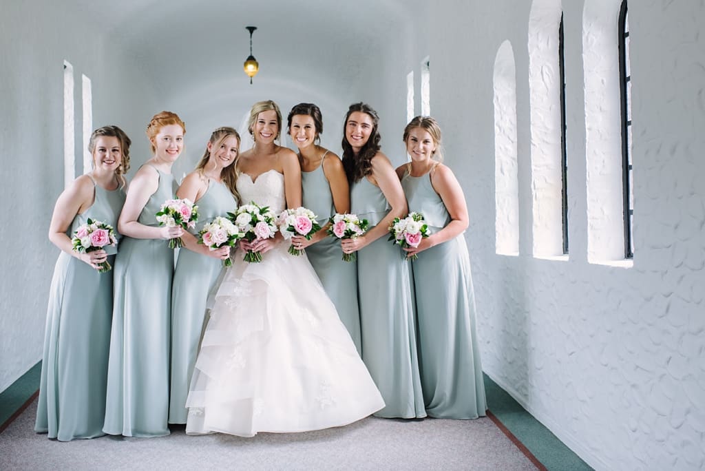 bridal party in church hallway