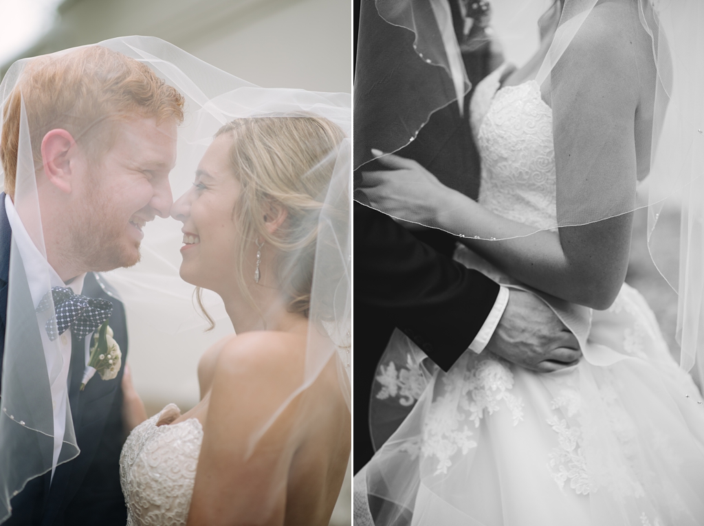 bride and groom beneath veil embrace