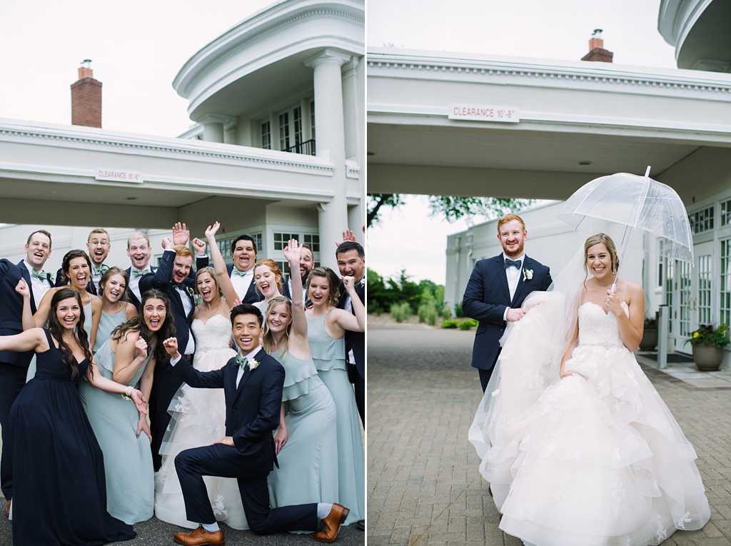 wedding party pose in front of reception venue, bride and groom pose with umbrella in rain