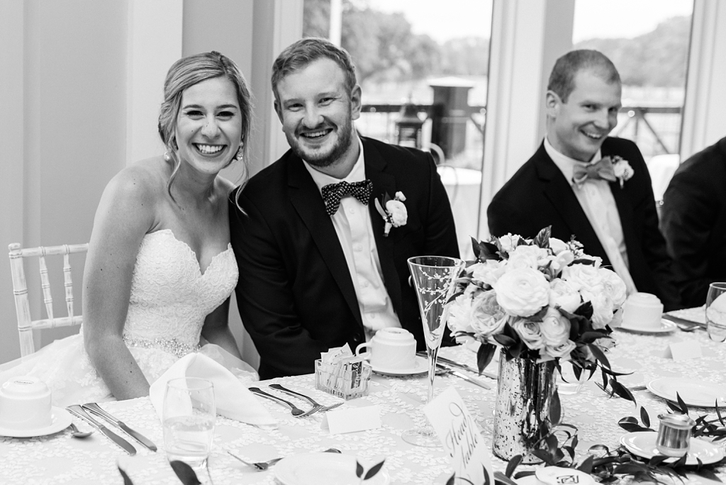 bride and groom and groomsman at wedding reception