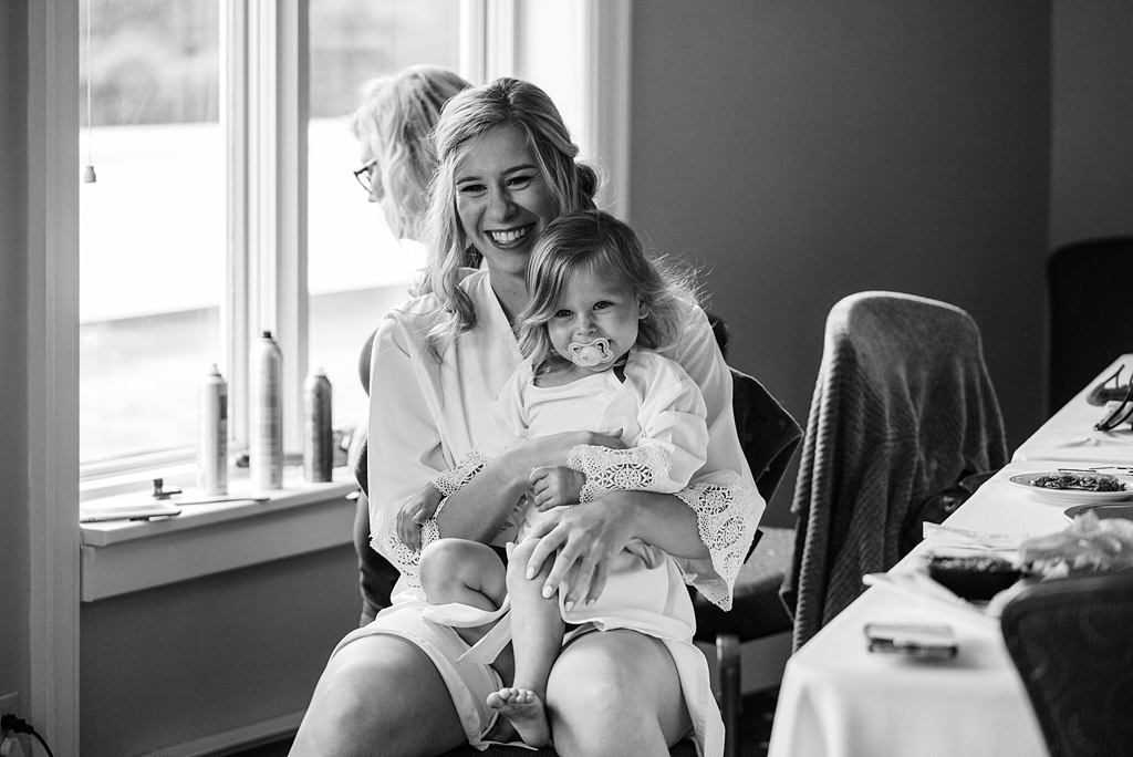 getting ready bride and flower girl