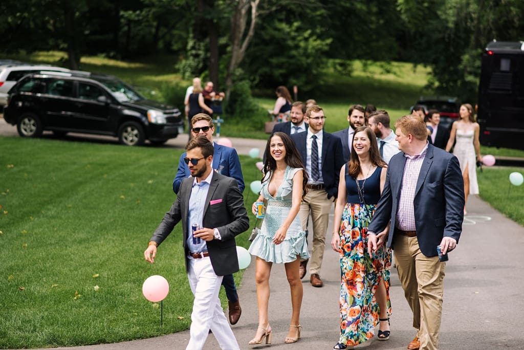guests arriving for wayzata backyard wedding