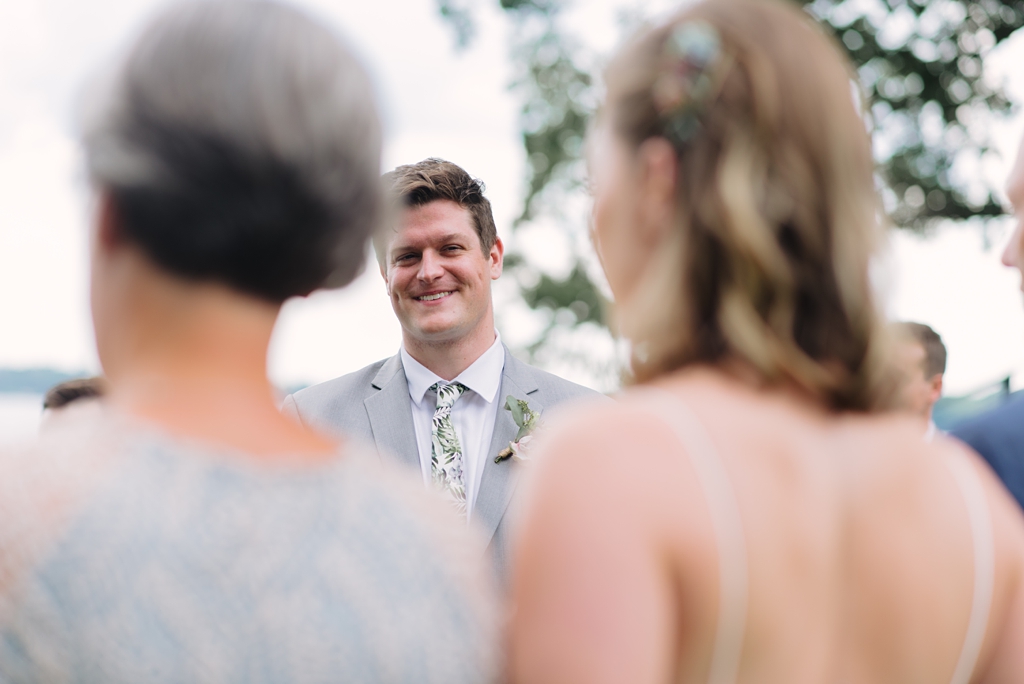 groom watching bride approach during ceremony