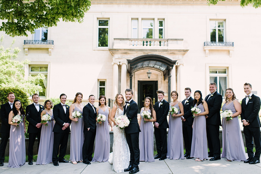 wedding party paired off in front of gale mansion minneapolis