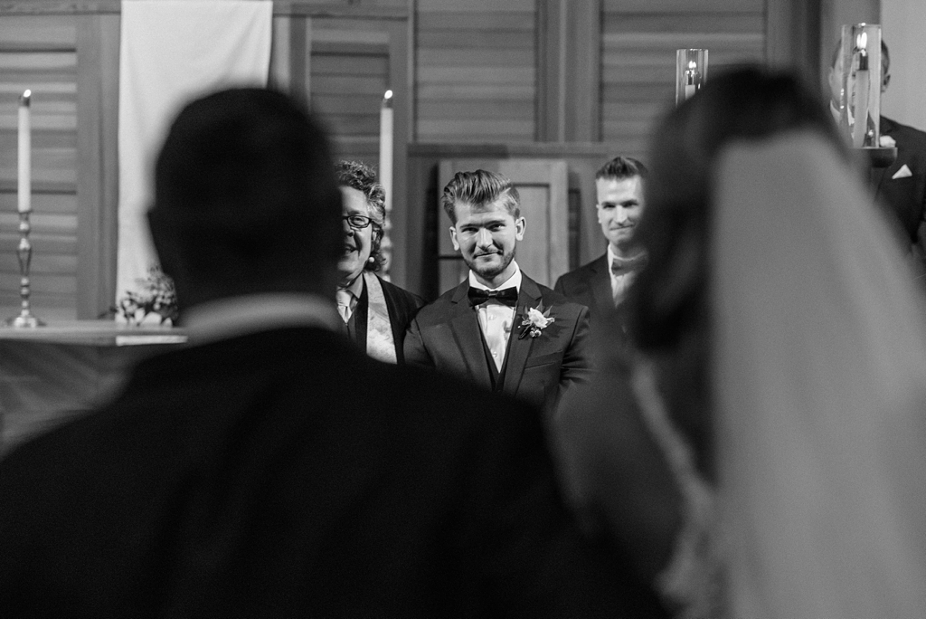 emotional groom watched bride walk down aisle
