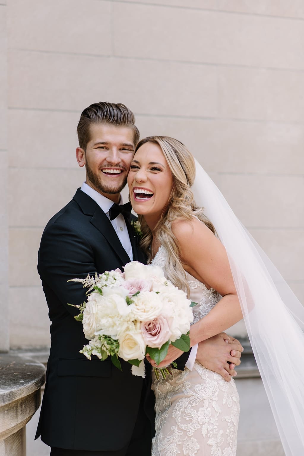 newlyweds embracing and laughing