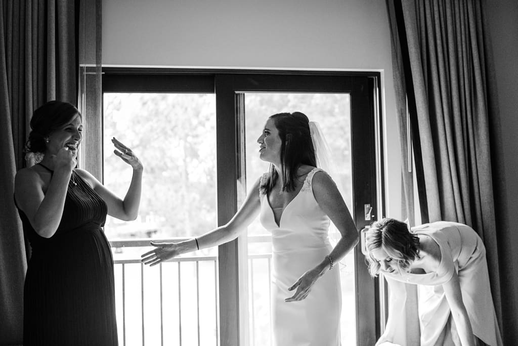 bride comforting crying bridesmaid