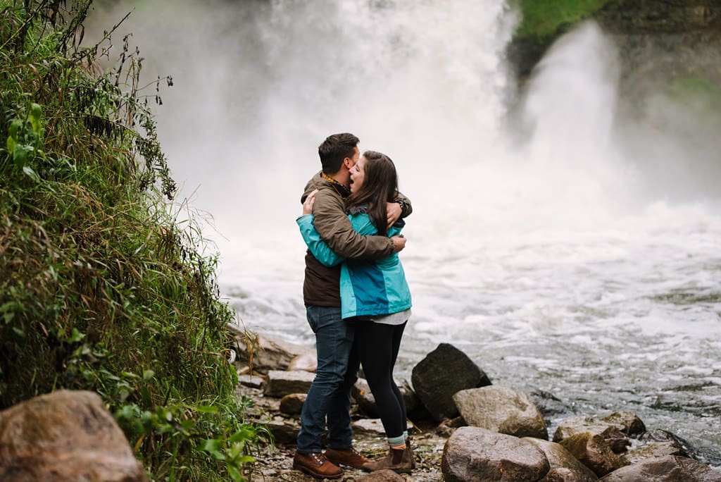 excited woman hugs man after surprise proposal