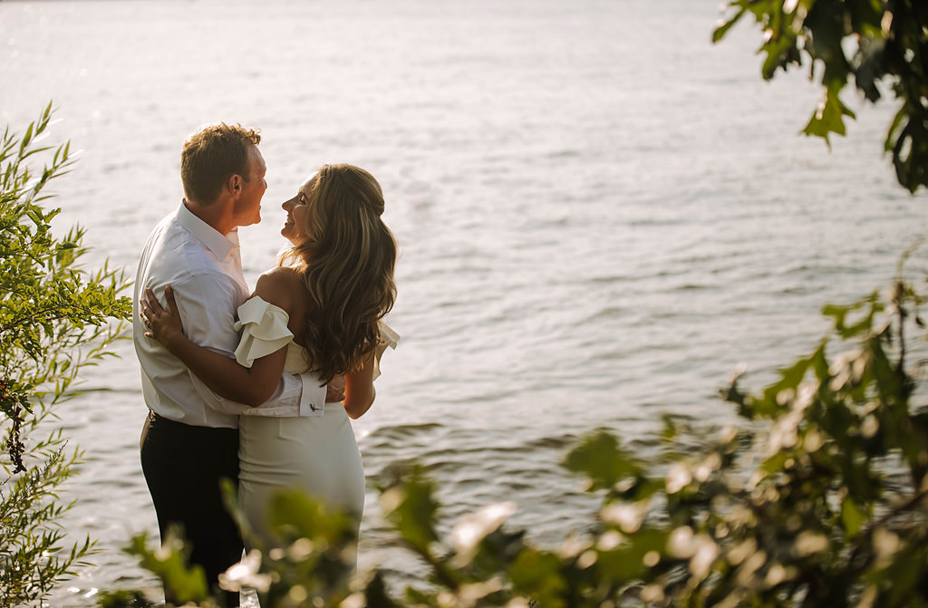 lakeside bride and groom at sunset elopement