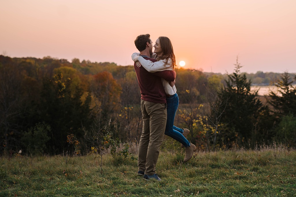 couple embracing at sunset during fall engagement session