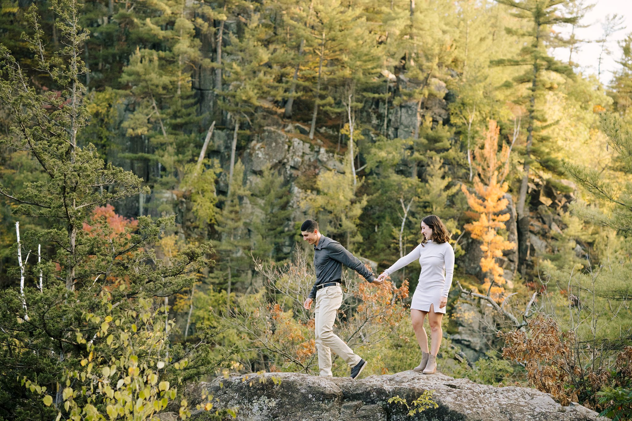 Engagement session couple walking together at Interstate falls in Minnesota for their engagement photos