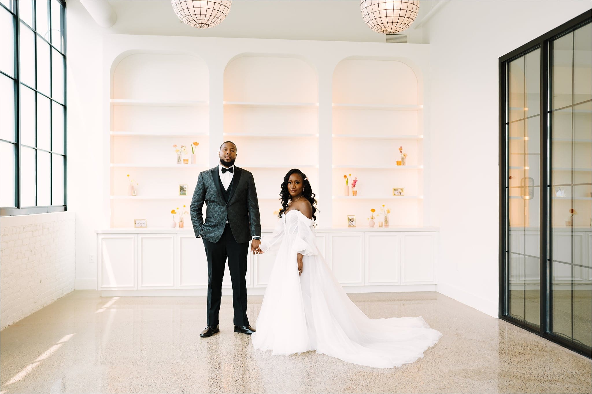 Bride and groom pose in their wedding venue The Whim in Minneapolis