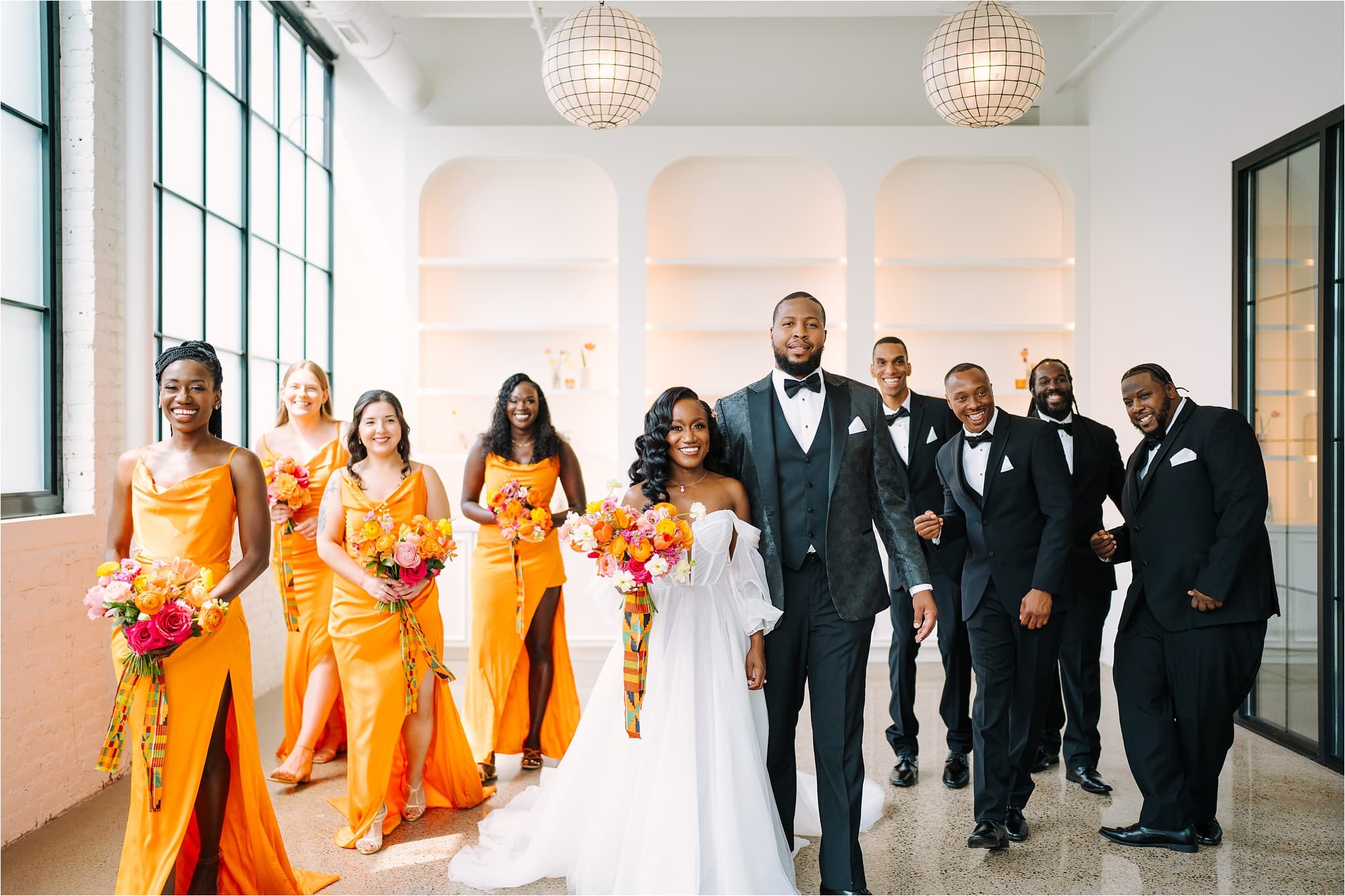 Wedding Party pose in their wedding venue The Whim in Minneapolis