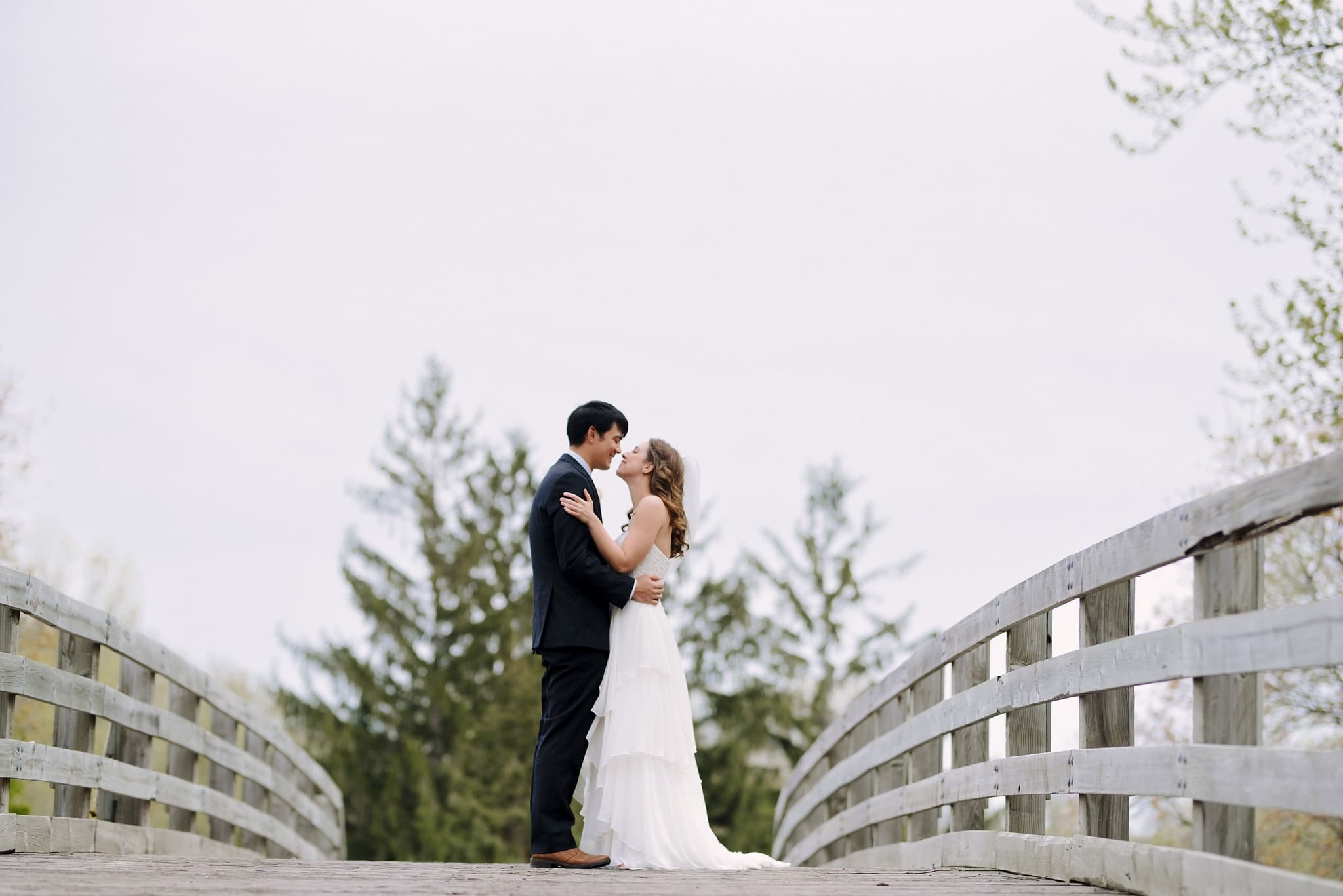 couple posing for their wirth chalet wedding photos
